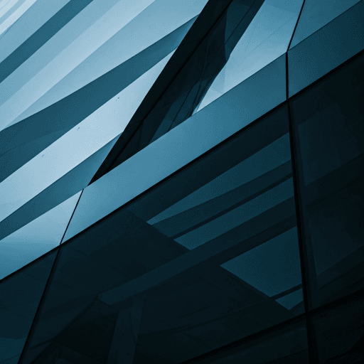 Close-up of a futuristic glass building facade with complex geometric reflections and deep blue architectural shadows.